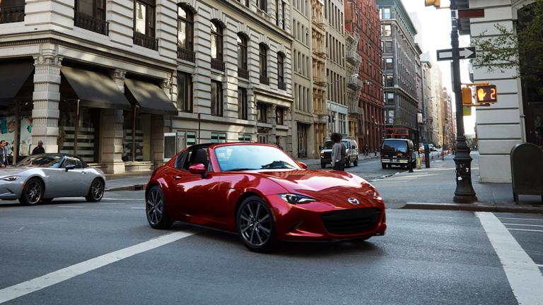2024 Mazda MX 5 Miata driving on the road.